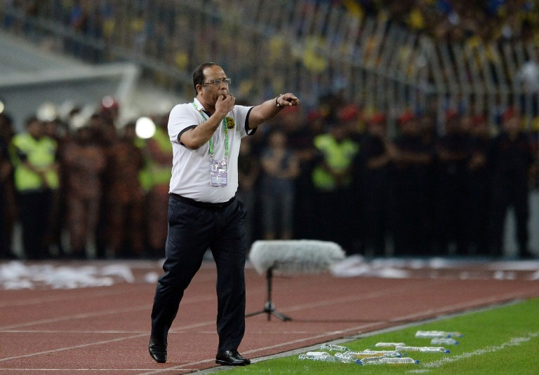Coach Dollah Salleh stepped down on Saturday, two days after presiding over Malaysia's thrashing in Abu Dhabi which made history as their worst ever defeat. PHOTO/AFP