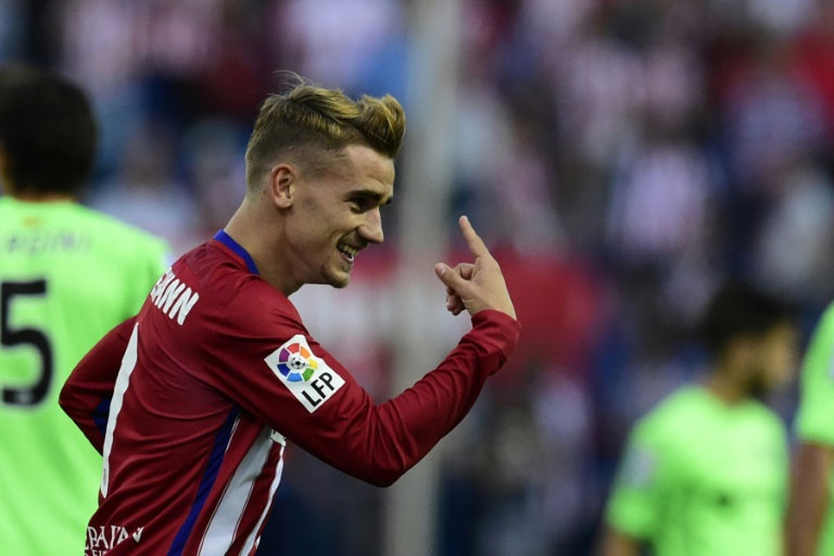Atletico Madrid's forward Antoine Griezmann celebrates after scoring a goal during a Spanish league football match against Getafe at the Vicente Calderon stadium in Madrid on September 22, 2015. PHOTO/AFP