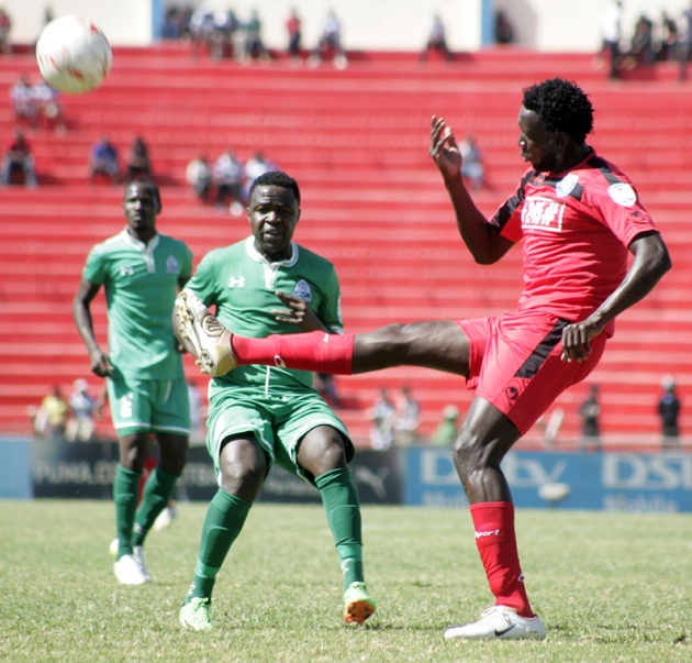 AFC Leopards defender Ivan Anguyo (L) with Gor Mahia midfielder Collins Okoth (R) when the two sides clashed in the 2015 second-leg 'Mashemeji Derby' clash at Nyayo National Stadium on August 23. PHOTO/Raymond Makhaya
