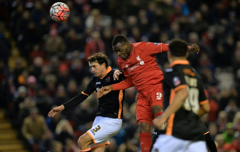 Liverpool's striker Christian Benteke (2nd L) misses a header attempt on goal during the English FA Cup third round replay football match between Liverpool and Exeter City at Anfield in Liverpool, England on January 20, 2016. PHOTO/AFP
