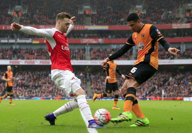 Hull City's Curtis Davies and Arsenal's Calum Chambers (left) battle for the ball during the English FA Cup, fifth round soccer match at The Emirates Stadium, London. PRESS ASSOCIATION Photo. Picture date: Saturday Feb. 20, 2016. Photo credit should read: (Jonathan Brady / PA via AP) UNITED KINGDOM OUT - NO SALES - NO ARCHIVES