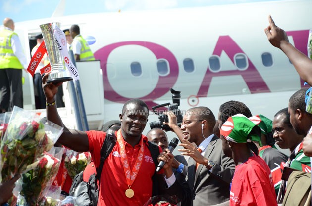 Kenya 7s captain Andrew Amonde lifting the trophy when the team arrived home on April 19 from Singapore.PHOTO/Timothy Olobulu