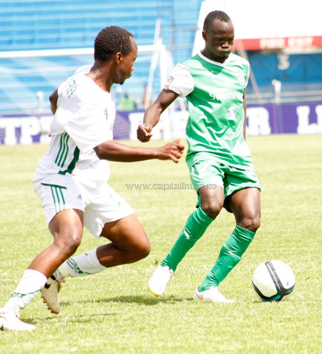 Gor Mahia’s Godfrey Walusimbi is closed down by Sony Sugar’s Hamidu Kwizera/ PHOTO-Courtesy