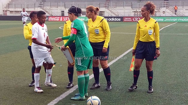 Harambee Starlets captain Aluoch with her Algerian counterpart before the match kicked off.PHOTO/courtesy
