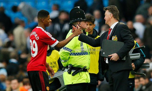 Manchester United manager Louis van Gaal shares a moment with striker Marcus Racshford after a past match/PHOTO- AGENCIES
