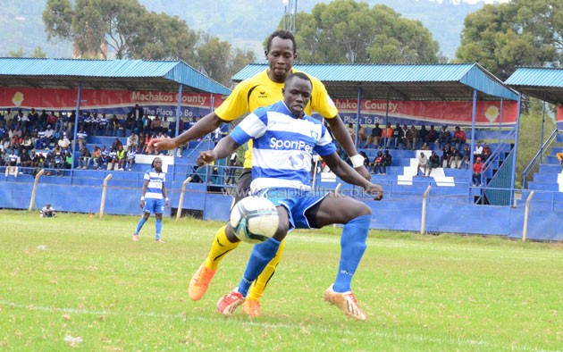 AFC Leopards goal scorer Alfred Wekesa (front) tries to find a way past Tusker FC defender Martin Kiiza.PHOTO/Timothy Olobulu