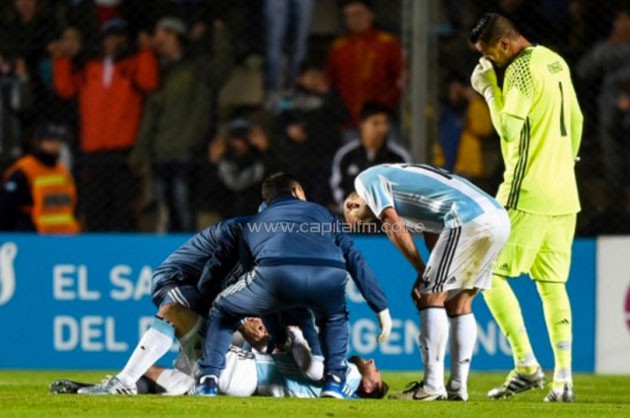 Argentina's forward Lionel Messi lays injured during a friendly football match against Honduras at Bicentenario stadium-PHOTO/AFP