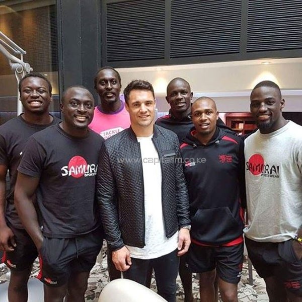 Kenya Sevens players pose for a photo with 2015 Rugby World Cup hero Dan Carter of New Zealand in Paris.PHOTO/courtesy