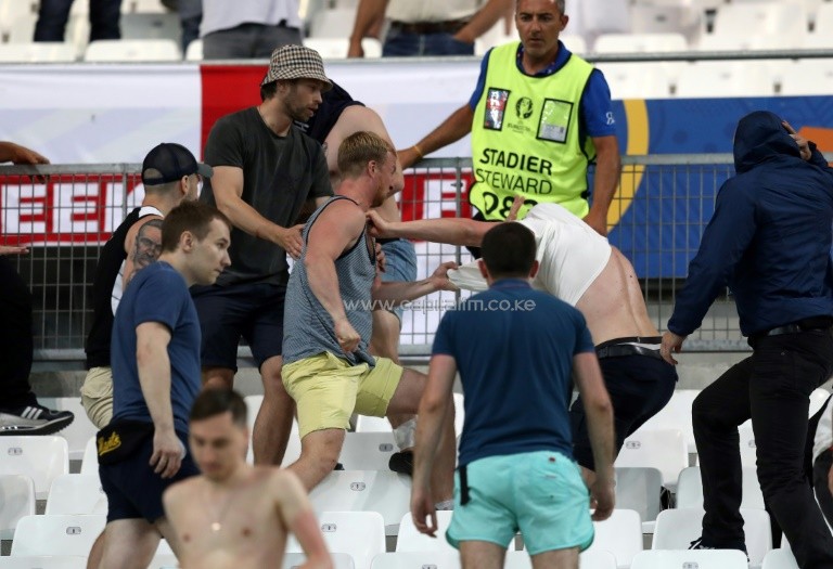 Supporters fight at the end of the Euro 2016 Group B match between England vs Russia, at the Stade Velodrome in Marseille, on June 11, 2016. PHOTO/AFP.