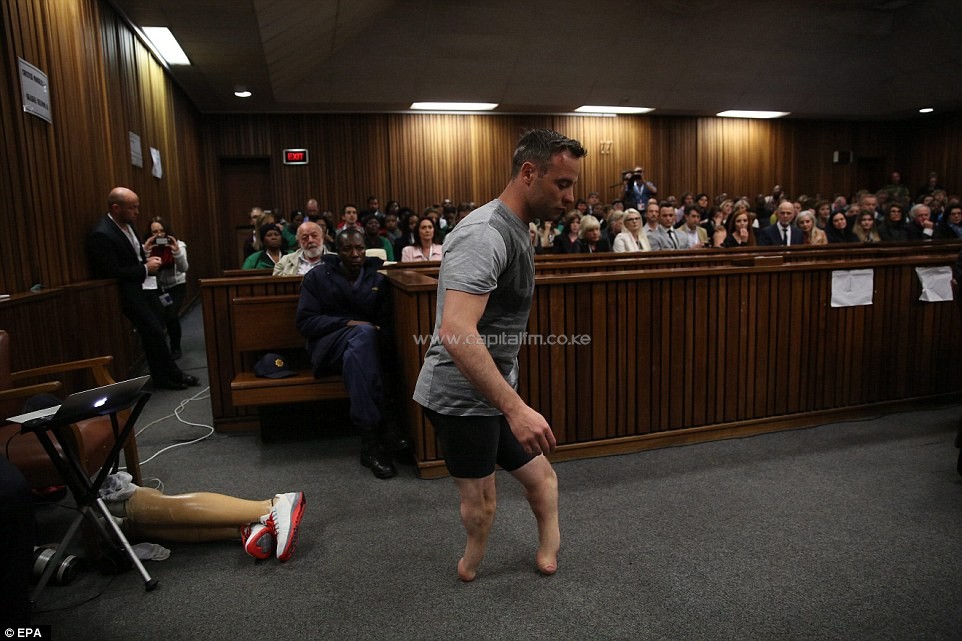 Humiliated: Paralympic gold medalist Oscar Pistorius walks across the packed courtroom on his stumps in a desperate last bid to convince a judge he was too vulnerable to have killed his girlfriend Reeva Steenkamp intentionally when he shot her at his home three years ago. PHOTO/DM.