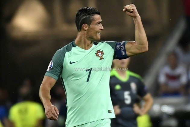 Portugal's forward Cristiano Ronaldo reacts after scoring the team's first goal during the Euro 2016 semi-final match between Portugal and Wales, on July 6, 2016.PHOTO/AFP