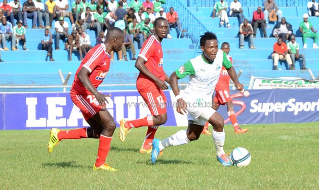 Gor Mahia winger George Odhiambo races away from Posta Rangers midfielder Moses Otieno.PHOTO/TRimothy Olobulu