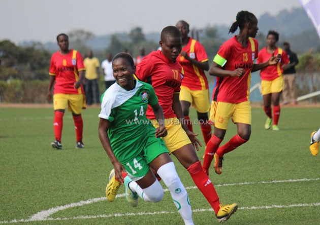 Harambee Starlets forward Esse Akida wheels away in celebration after scoring against Uganda. PHOTO/COURTESY