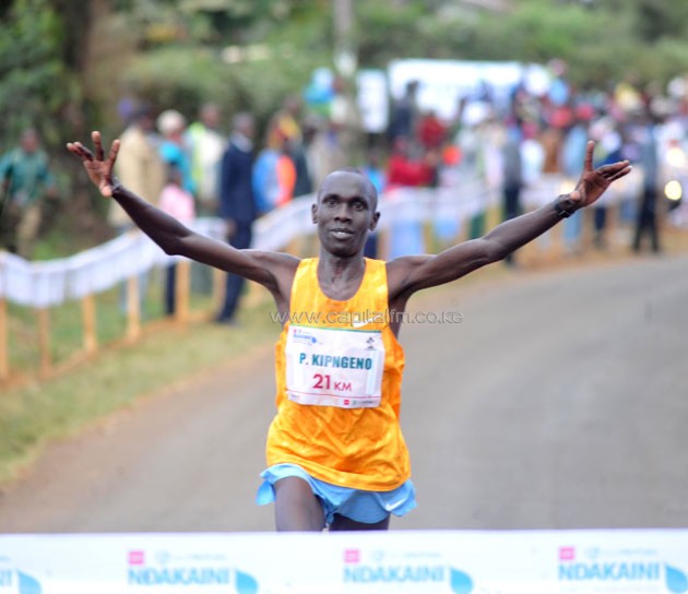 Patrick Kingeno celebrates 21km win.PHOTO/Raymond Makhaya.