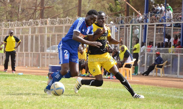 Tusker's George Mandela beats Posta's Simon Mbugua to the ball in the build up to Tusker's opening goal.PHOTO/Timothy Olobulu