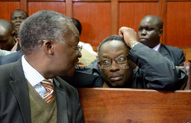 NOCK 1st Vice-president Ben Ekumbo (holding his head) appearing before Milimani Law Court Resident Magistrate Joyce Ngandani.PHOTO/Timothy Olobulu
