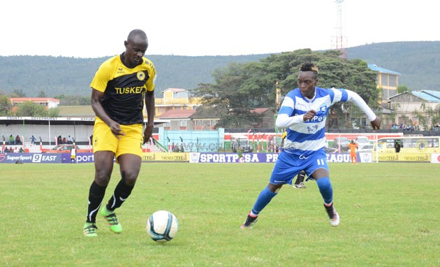 Tusker FC right back Osborne Monday attempts to go past AFC Leopards' John Ndirangu in a KPL match on November 6, 2016. he provided the assist for the winning goal. PHOTO/Timothy Olobulu