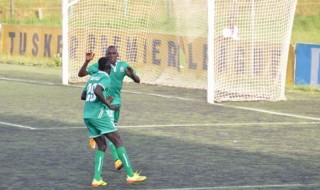 Michael Olunga (left) and Meddie Kagere celebrate a goal.