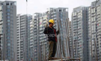 A man carrying out construction work in China/AFP