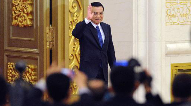 Chinese Premier Li Keqiang arrives at a press conference/AFP