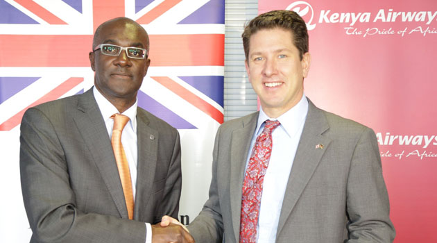 Kenya Airways Chief Executive, Mbuvi Ngunze and British High Commissioner, Christian Turner, exchange Memorandum of Understanding documents during the handover of Exclusive Trace Detector (ETD) equipment from the British Government to the airline/CFM