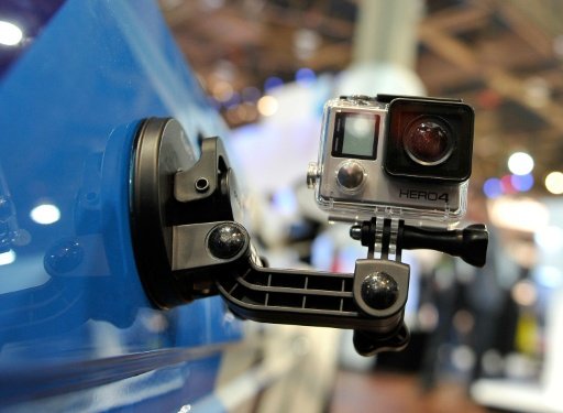 Shares of GoPro jumped on word that the troubled maker of mini-cameras popular for capturing first-person action had hired away a longtime Apple designer