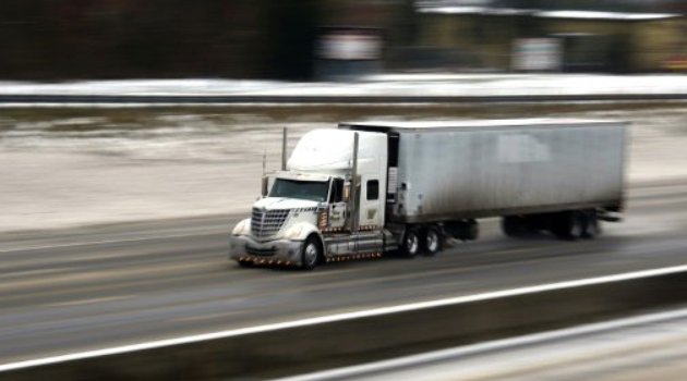 Under new US standards tractor-trailers, delivery trucks and school buses will be forced to reduce carbon emissions by up to 25 percent by 2027/Getty/AFP-File