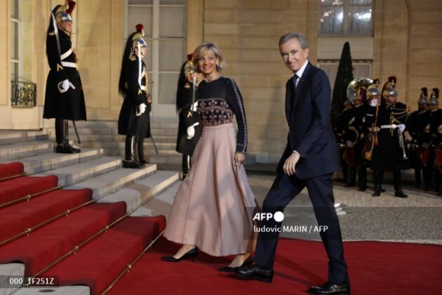 LVMH CEO Bernard Arnault and his wife Helene upon arrival to the