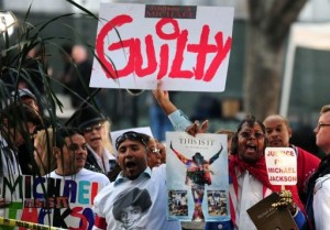 Supporters of Michael Jackson hold placards outside the courthouse where Conrad Murray's trial was being held in Los Angeles on November 7, 2011. Murray was found guilty over the King of Pop's 2009 death, triggering an explosion of joy from his family and fans. © AFP Frederic J. Brown