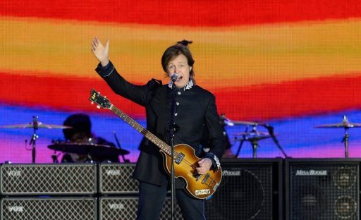 British singer Sir Paul McCartney performs on stage during the Queen's Diamond Jubilee Concert at Buckingham Palace in London. (AFP Photo/Leon Neal)