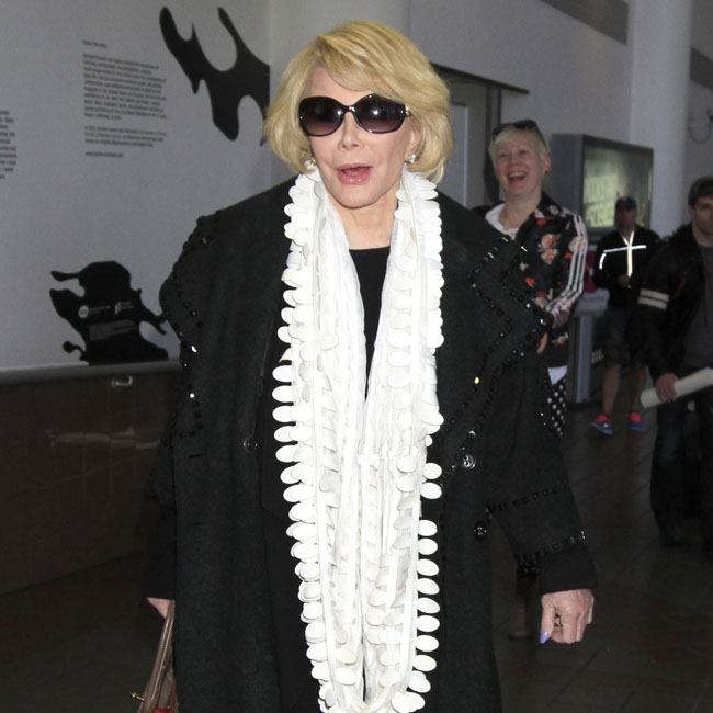 Joan Rivers arrives back in Los Angeles after a brief stint in Canada