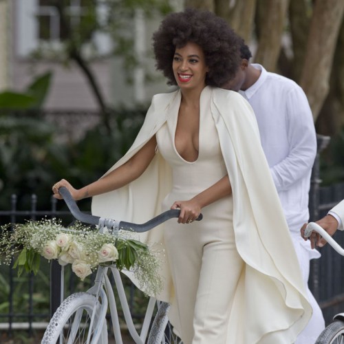 Solange Knowles and Alan Ferguson arrive at their wedding on white bicycles.