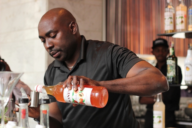 Yeri Randu from Sankara Nairobi preparing his cocktail 'Strawberries Olmeca Booster'