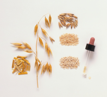 Dried oatstraw, fresh oat stalk and grains, pipet filled with oat-based remedy, oatbran and oatmeal