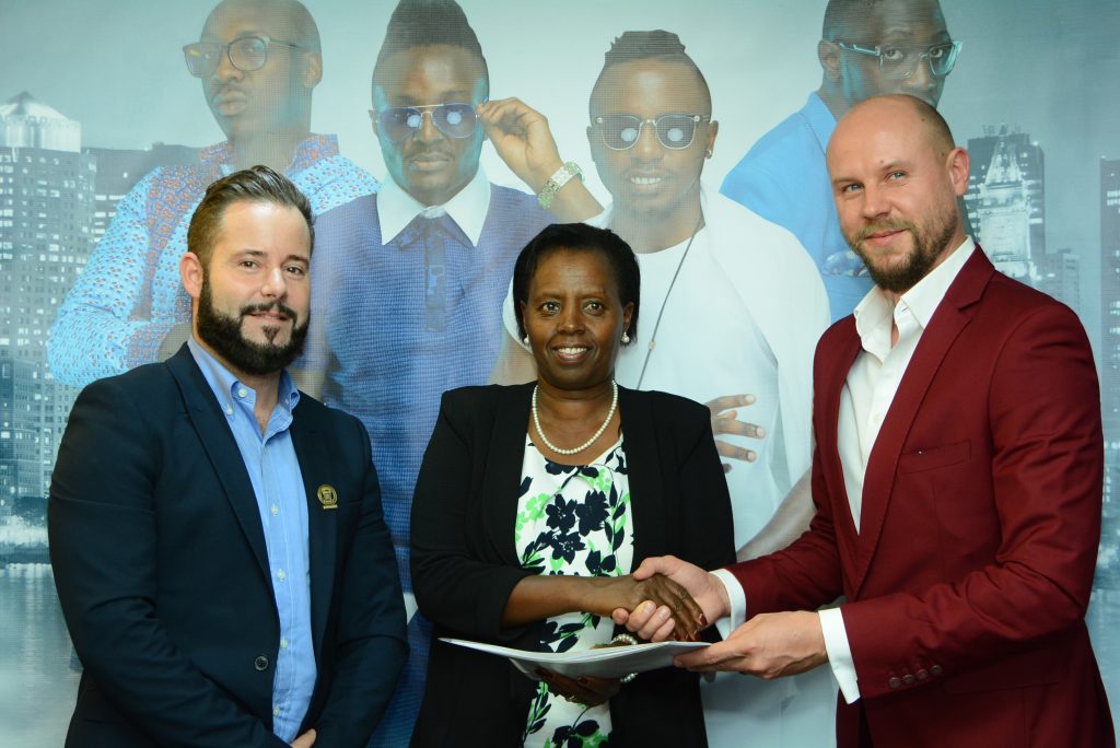 Kenya Breweries Limited (KBL), Managing Director Jane Karuku with Marek Fuchs (right) Sauti Sol Managing Director and KBL Marketing & Innovations Director, Stephen O’Kelly during the signing of endorsement deal between Sauti Sol and Chrome Vodka