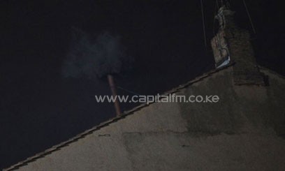 Black smoke rises from the chimney on the roof of the Sistine Chapel/AFP