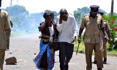 People in Malawi, flee tear gas fired at demonstrators/AFP