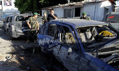 Lebanese security forces inspect the site where a rocket exploded in Shiah, a southern suburb of Beirut, on May 26, 2013. Two rockets slammed into the Hezbollah heartland of south Beirut on Sunday as fighters from the Lebanese Shiite group battled alongside regime forces against rebels in a key town in neighbouring Syria/AFP 