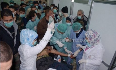 Medics treating a casualty at a hospital in Khan al-Assal in Aleppo province/AFP
