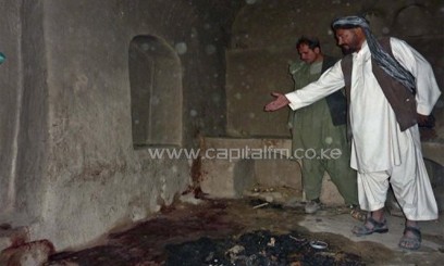 A villager points to a spot where a family was allegedly shot in their residence by a rogue US soldier in Panjwayi district, Kandahar province on March 11, 2012/AFP