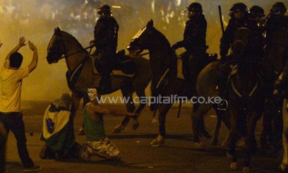 Demonstrators confront riot police after clashes erupted in Brazil/AFP