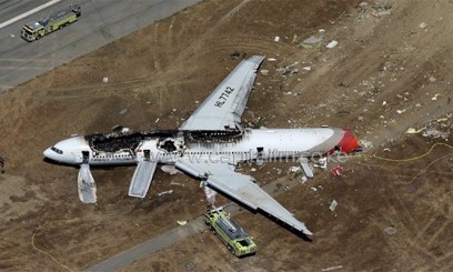 An Asiana Airlines Boeing 777 passenger jet crashed and burst into flames as it landed short of the runway at San Francisco International Airport, killing two people and injuring 181 others/AFP