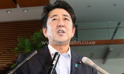 Japanese Prime Minister Shinzo Abe speaks to reporters at his official residence in Tokyo on September 10, 2013/AFP