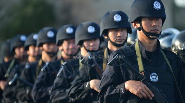 An anti-terrorism force attends an anti-terrorism joint exercise in Hami, northwest China's Xinjiang region on July 2, 2013/AFP