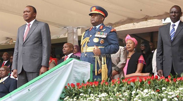 President Kenyatta with CGS Gen. Julius Karangi acknowledge a military march past at Kasarani. Photo/ FELIX MAGARA