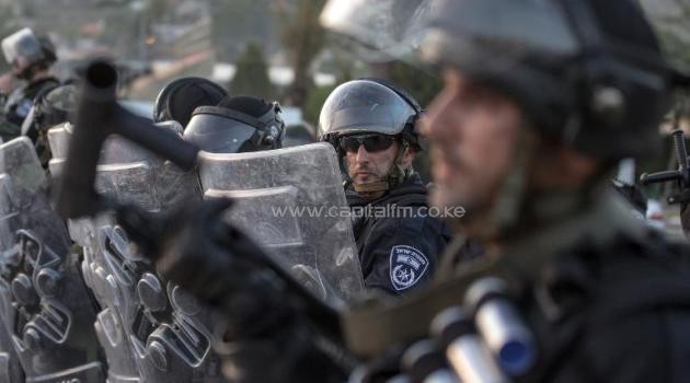 Israeli riot police secure a street during clashes with Palestinian protesters in the Arab Israeli city of Ar'Ara, north of Israel, on July 5, 2014/AFP