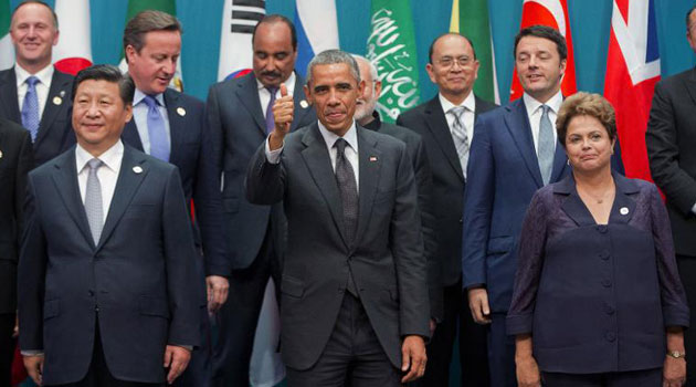 World leaders are seen gathering for a 'family photo' during the G20 Summit in Brisbane, on November 15, 2014/AFP