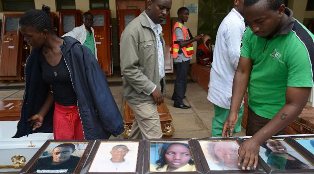 Relatives look at portraits of students killed in last week's attack on the Garissa University campus by Somalia's al-Qaeda-linked Shebab insurgents, at the Chiromo morgue, on April 9, 2015 in Nairobi © AFP