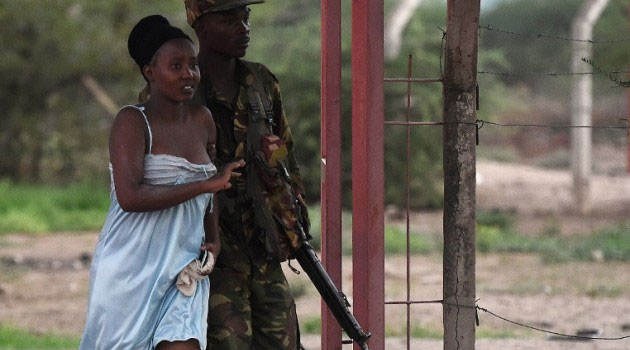 A soldier escorts a student to safety during the April terrorist attack at Garissa University College, which is in the same town as Garissa Teachers College. Photo/ FILE