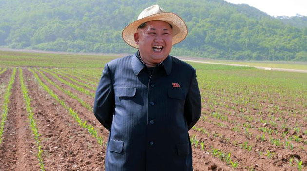 Undated photo shows North Korean leader Kim Jong-Un inspecting the farm No. 1116 under Korean People's Army unit 810 at an undisclosed place in North Korea  © KCNA via KNS/AFP